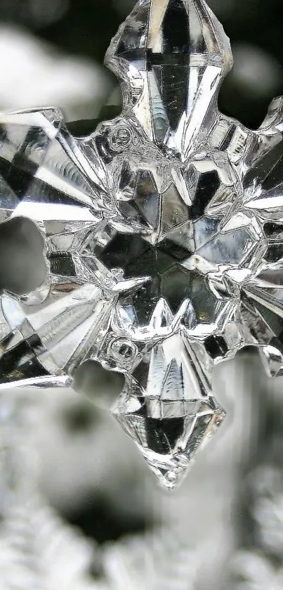 Close-up of a crystal snowflake with a blurred white background.