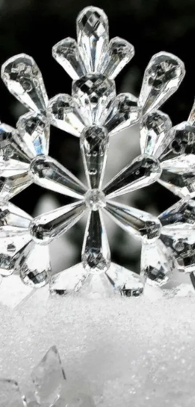 Crystal snowflake resting on white snow background.