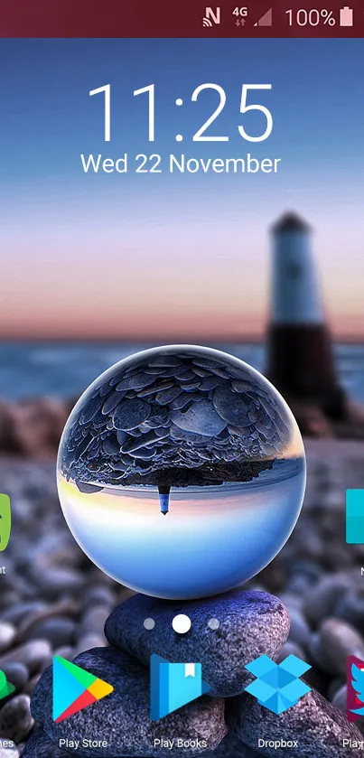 Mobile wallpaper with a crystal sphere and blurred lighthouse at the beach.