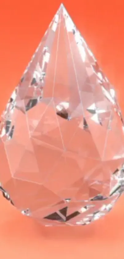 Crystal teardrop with orange background, elegant design.