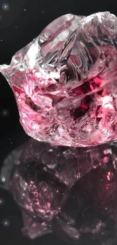 Clear gemstone reflecting on sleek black background wallpaper.