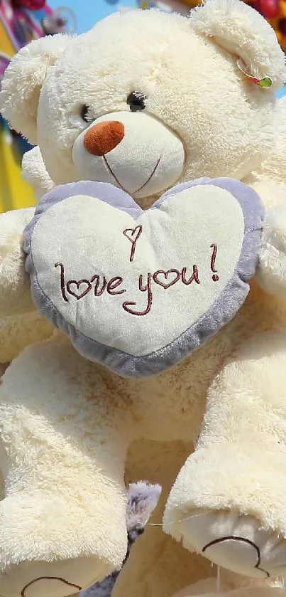 Cuddly teddy bear holding 'I love you' heart.