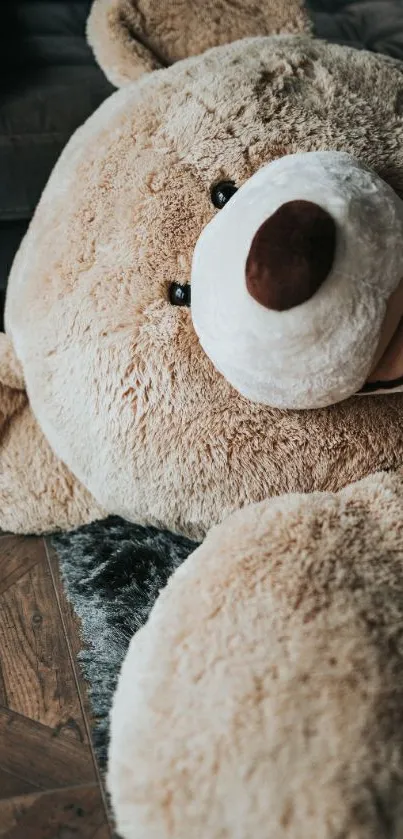 Cozy plush teddy bear on a rustic floor.