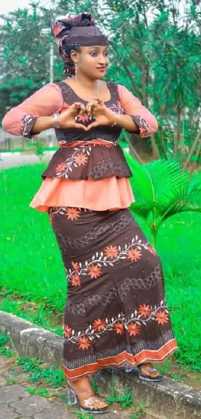 Woman in cultural attire with green background for mobile wallpaper.