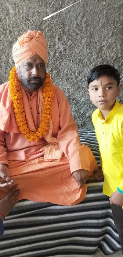 Monk in orange with child in vibrant cultural setting.