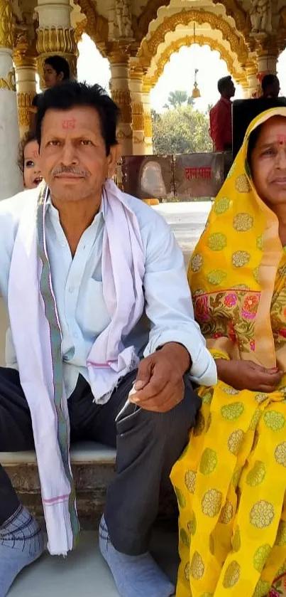 Couple in traditional attire at a temple.