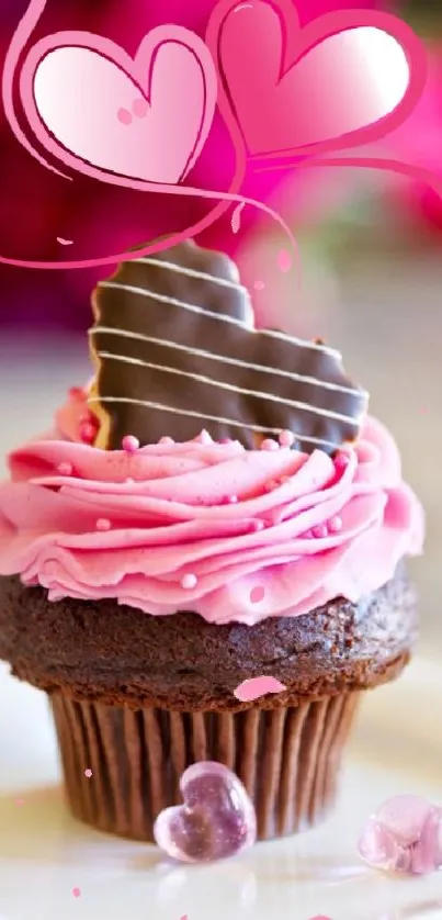 Pink frosted cupcake with chocolate heart.