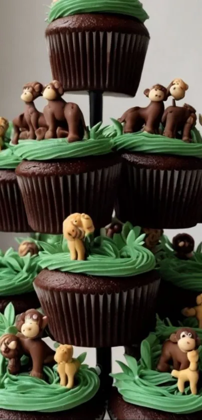 Chocolate cupcake tower with animal-themed toppers.