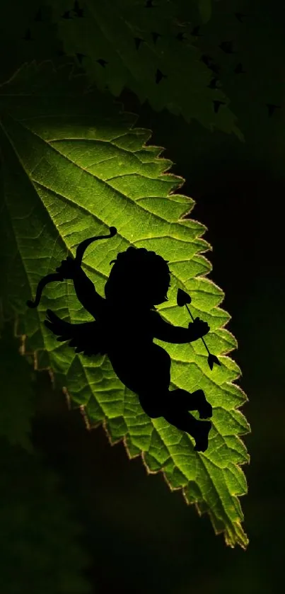 Silhouette of cupid on a vibrant green leaf.