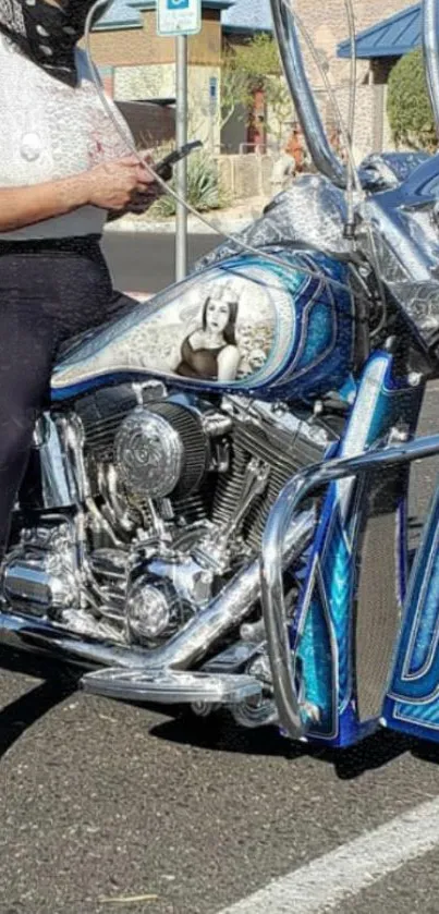 Custom motorcycle with blue accents and chrome on street.