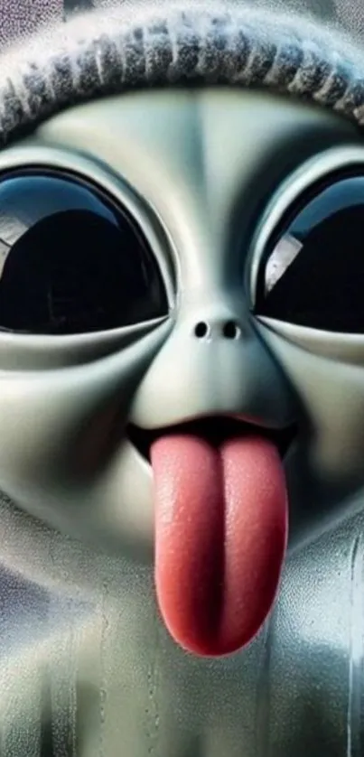 Adorable cartoon alien with large eyes and tongue sticking out.