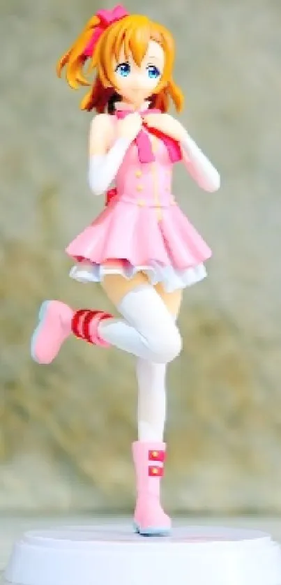Cute anime figure in pink dress with playful charm on textured background.