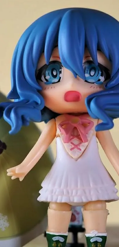 Cute anime figurine with blue hair on display.