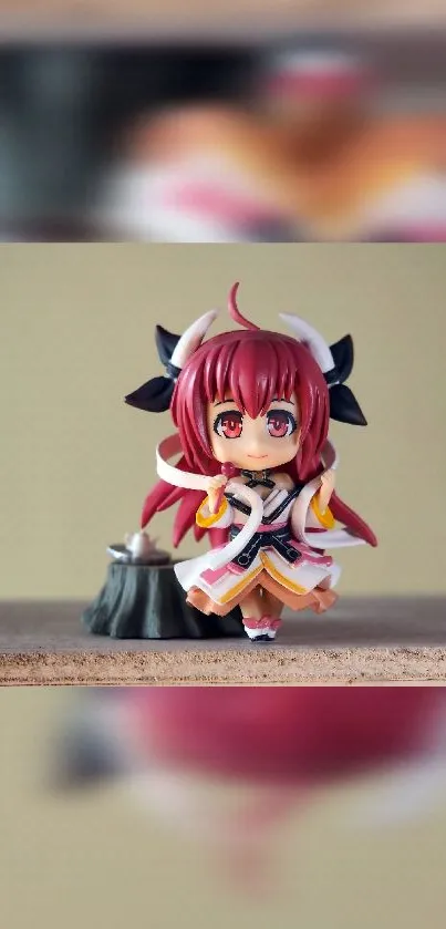 Adorable anime figurine with red hair on a beige background.