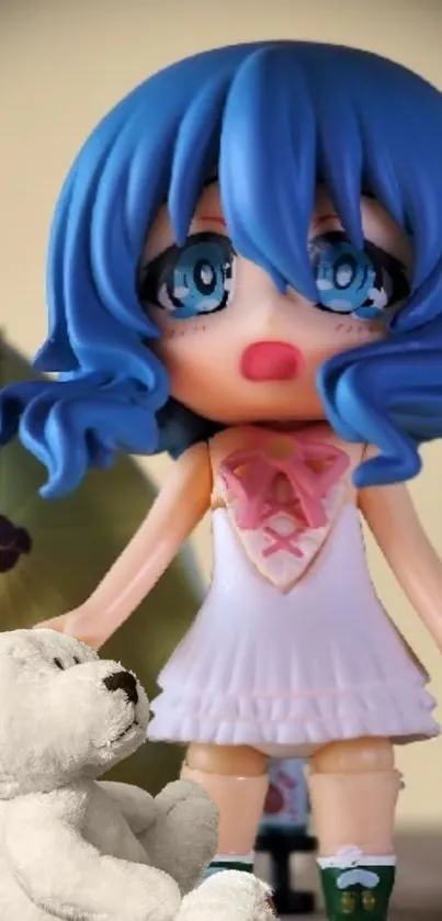 Anime figurine with blue hair and teddy bear.