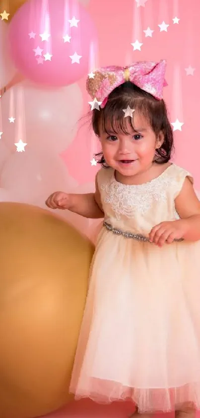 Adorable baby in pink dress with balloons.