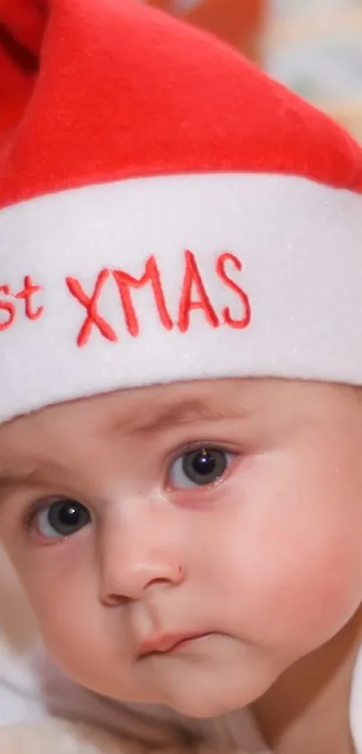 Adorable baby in a Santa hat celebrating Christmas.
