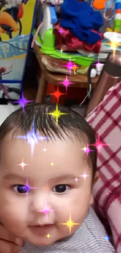 Smiling baby with colorful toys in the background.