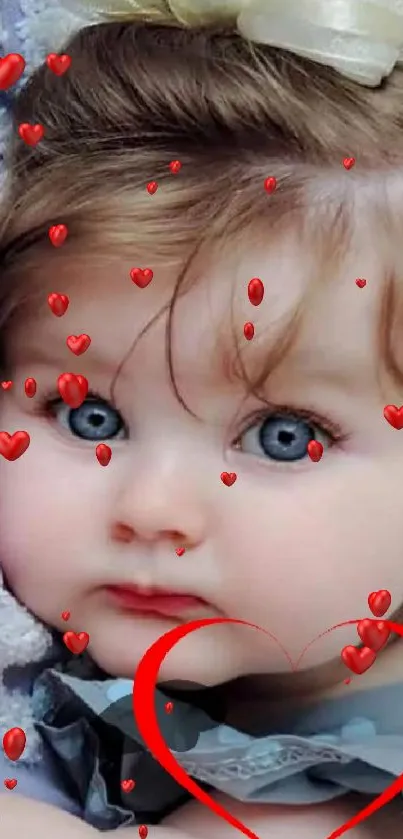 Cute baby with blue eyes and red heart overlay mobile wallpaper.