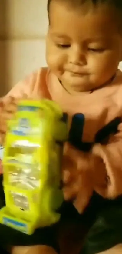 Adorable baby playing with a yellow toy bus on a cozy couch.