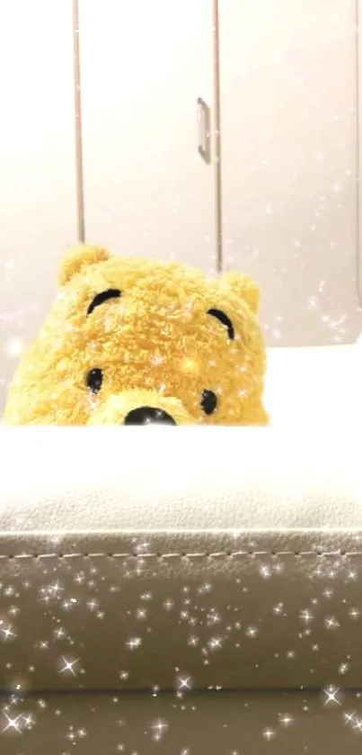 Adorable bear plush with sparkles in a cozy setting.