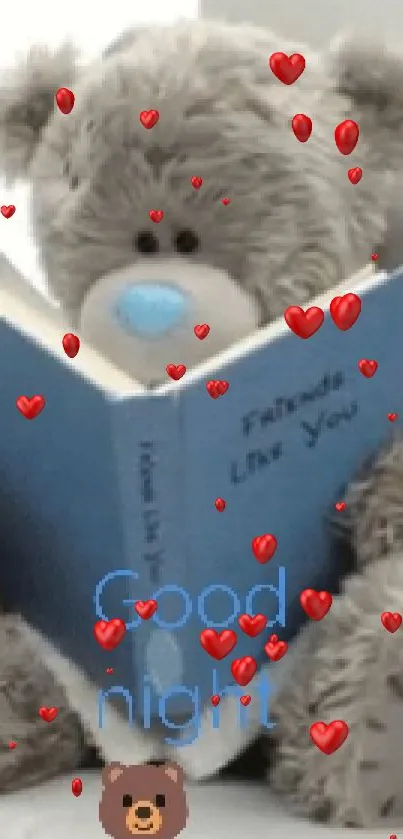 Teddy bear reading a blue book on a sofa with 'Good Night' text.