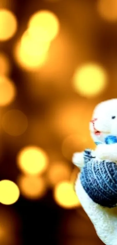 Soft toy bunny with yarn on glowing golden bokeh background.