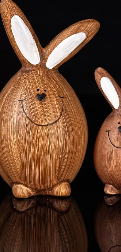 Cute wooden bunny figurines on black background, perfect for cozy mobile wallpaper.