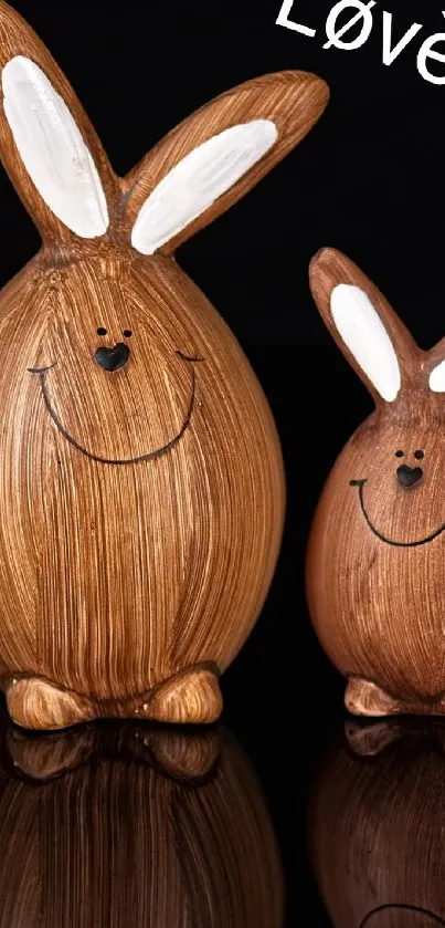 Two smiling wooden bunnies with 'Love' text, perfect mobile wallpaper.