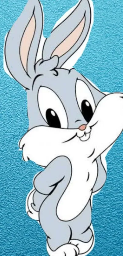 Cute cartoon bunny on blue textured background wallpaper.