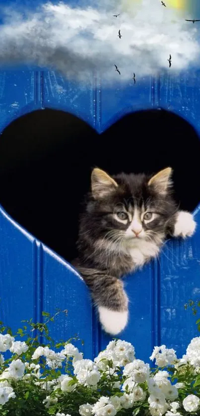 Cute kitten peeking through a blue heart-shaped wall, surrounded by white flowers.