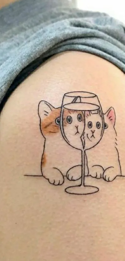 Cartoon cat tattoo with wine glass on arm.