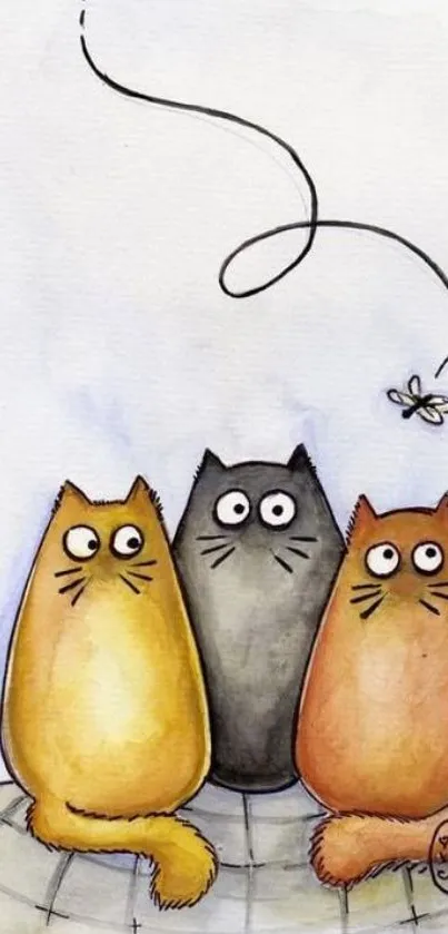 Whimsical illustration of three cats with a toy fly on a mobile wallpaper.