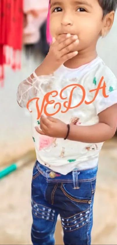 Cute child wearing white shirt and jeans in a casual pose.