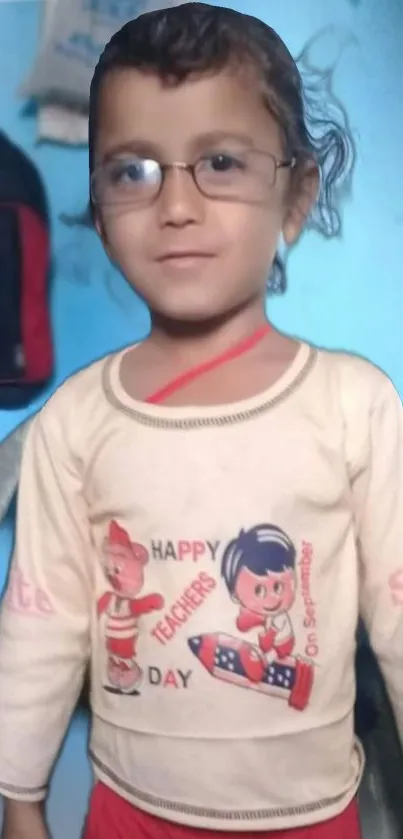 Cute child wearing glasses with a happy expression indoors.