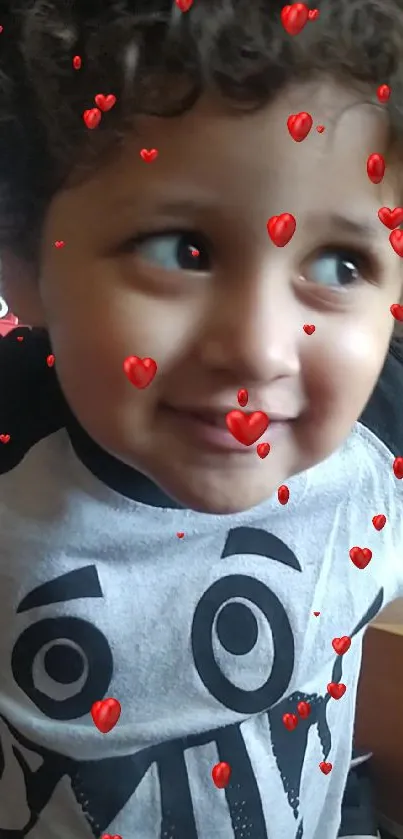 Cute child with playful heart filter and joyful smile.