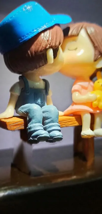 Adorable couple figurine on bench sharing a kiss.