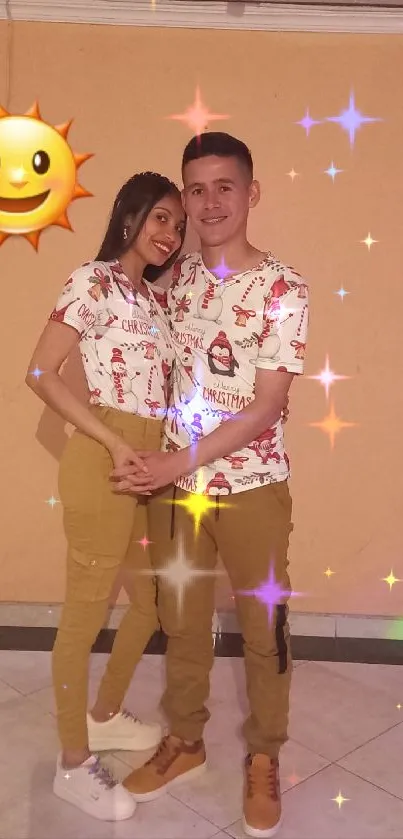 A couple in matching outfits smiling with a beige background.