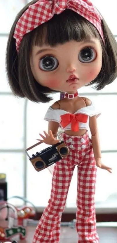 Adorable doll wearing checkered outfit holding boombox in bright setting.