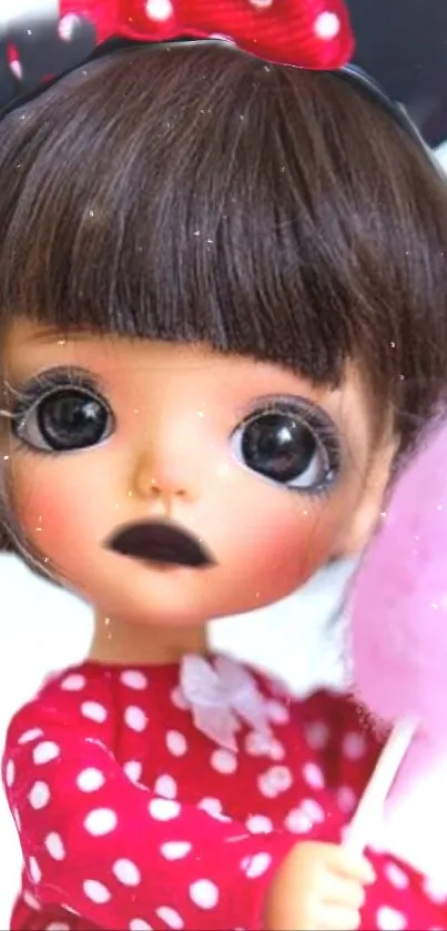Cute doll in red polka dot dress with pink cotton candy.