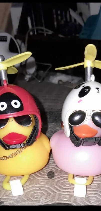 Two toy ducks wearing helmets and sunglasses, creating a playful vibe.