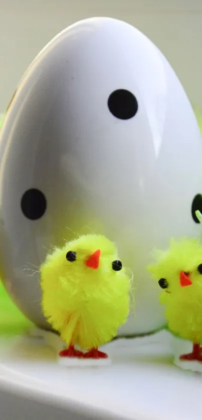 Easter-themed mobile wallpaper with yellow chicks and a polka-dotted egg.