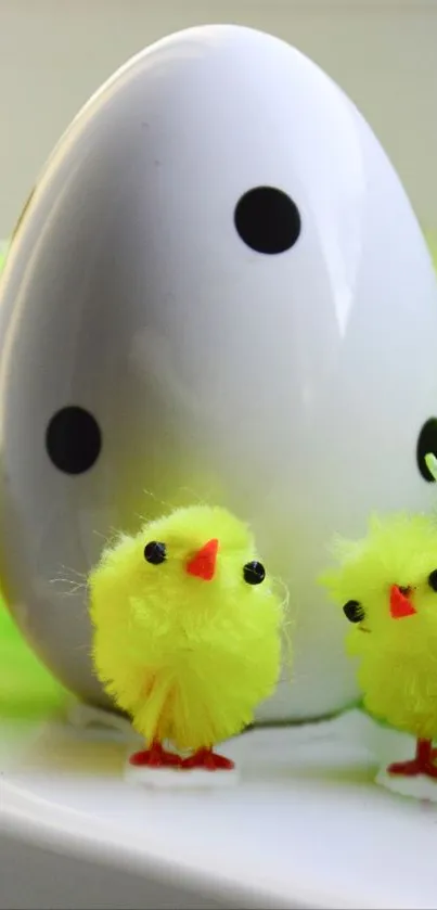 Cute yellow chicks with a large decorative egg.