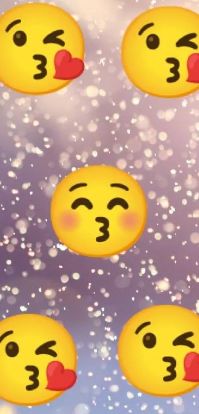 Cute wallpaper with kissing emojis on a pastel bokeh background.