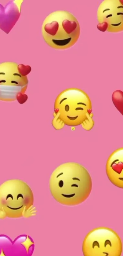 Cute pink emoji wallpaper with hearts and smiling faces.