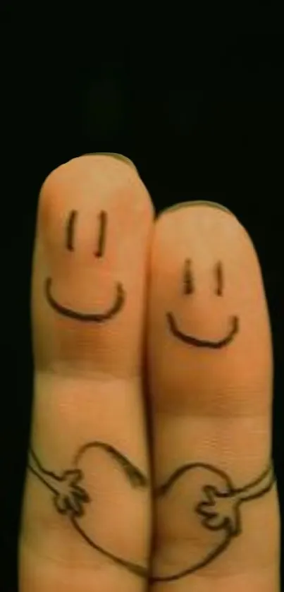 Cute finger art with smiling faces and heart on black background.