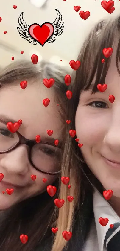 Two friends smiling with heart filter overlay.