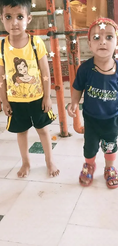 Two cute kids in vibrant outfits indoors.