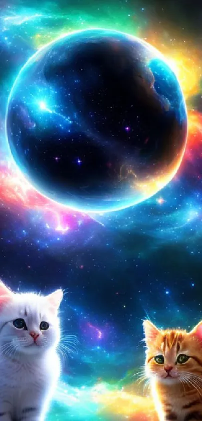 Kittens beneath colorful cosmic galaxy with glowing planet