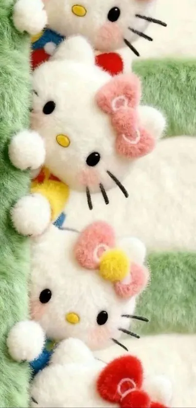 Cute plush kitties peeking from green background with bows.